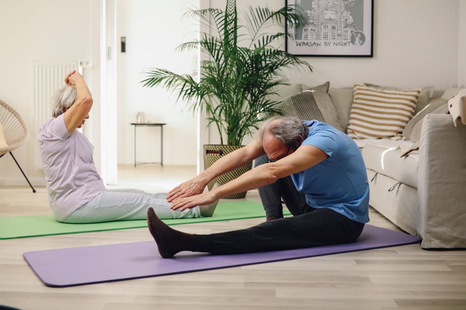 Man and woman practicing gentle yoga on mats at home
